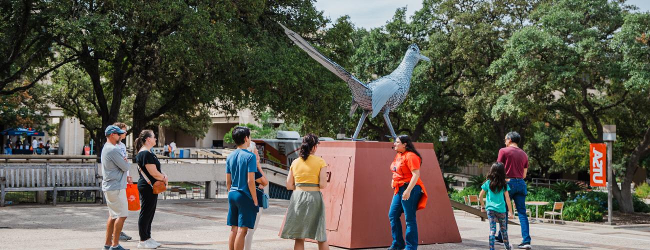 Rowdy Statue off of Sombrilla with students around